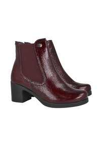 Botines burdeos con un acabado brillante en charol, paneles laterales elásticos, tacón block y un diseño de punta suave.