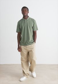 BOSS DYE - Polo majica - open green