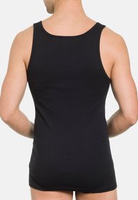 Black cotton tank top with a round neckline and wide shoulder straps, fitted design, smooth texture, and no visible patterns or hardware.
