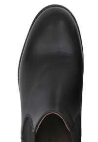 Scarpa in pelle nera con finitura liscia, caratterizzata da una punta a mandorla e pannelli laterali elasticizzati per facilitarne l'indossamento.