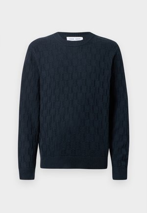 Marineblå strikket sweater med et tekstureret mønster, rund hals og ribbede manchetter og kant. Fremstillet af blødt garn for komfort.