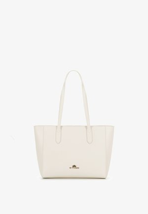 Beige kožená taška přes rameno s hladkým povrchem, dvěma dlouhými uchy a decentním zlatým logem uprostřed. Obdélníkový tvar.