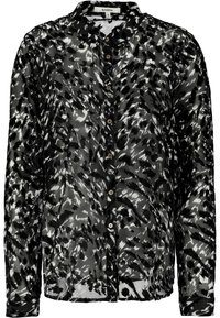 Blusa trasparente a righe bianco e nero con maniche lunghe, colletto, chiusura frontale con bottoni e tessuto testurizzato.