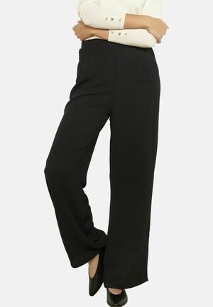 - Spodnie materiałowe