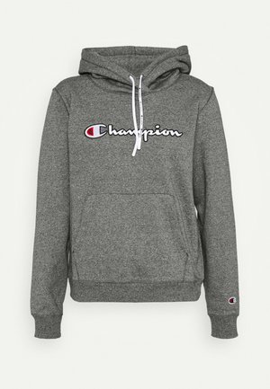 Szara bluza z kapturem Champion z białymi troczkami, przednią kieszenią kangurką oraz logo Champion na piersi i mankiecie lewej rękawa.