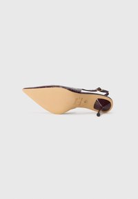 Pointed-toe slingback heel in dark burgundy faux crocodile leather. Features a slender stiletto heel and beige outsole with embossed logo.