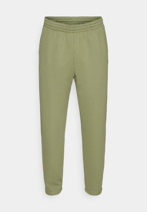 Green sweatpants made of soft fabric, featuring an elastic waistband and tapered legs. No visible patterns or accents.