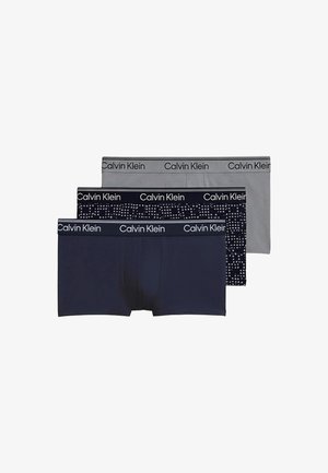 Tres pares de bóxers para hombre Calvin Klein en gris, azul marino y azul marino con estampado de puntos blancos, cada uno con cinturilla con la marca.
