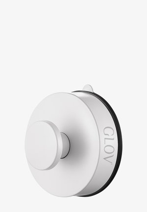 Valkoinen pyöreä seinähaka, jossa on pyöreä pohja ja keskellä nuppi. Haka on varustettu mustalla kumikoristeella ja siinä on kaiverrettu "GLOV" sivulle.