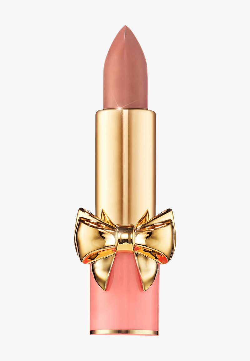 Lipstick with a pink and gold tube, featuring a textured gold bow accent. The bullet is a soft nude color with a pointed tip.