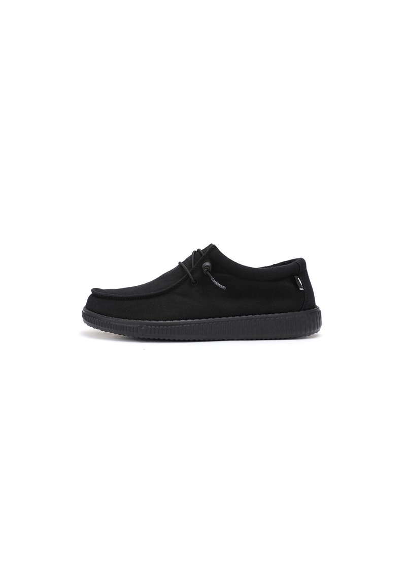 Black slip-on shoes made of soft fabric with a rounded toe, textured black rubber sole, and adjustable lace for a secure fit.