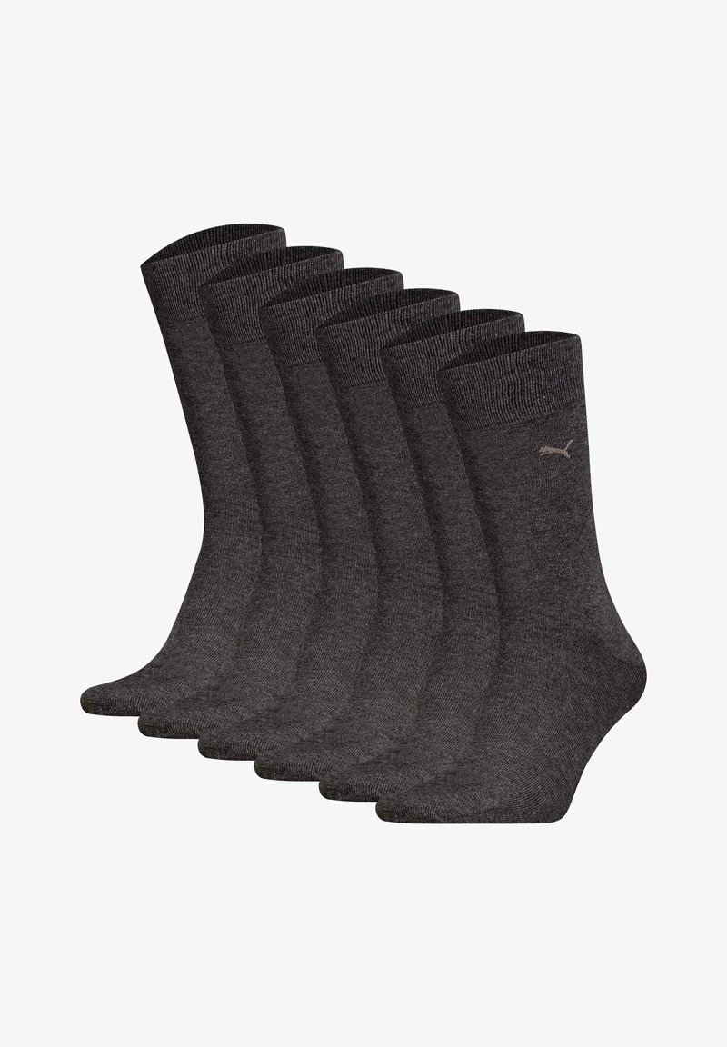 Conjunto de calcetines de algodón gris, con puño acanalado, textura suave y un pequeño logo. Seis pares exhibidos en una disposición apilada.