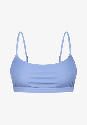 Heledsinine bikiinitop, millel on õhukesed reguleeritavad rihmad, sile tekstuur ja lihtne disain. Omab kumerat kaelust ja sirget alumist äärt.