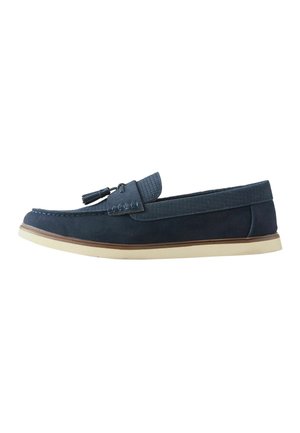 Navy blue leather loafer with textured upper trim, tassel detail, white sole, and brown midsole stripe, shown from left side.