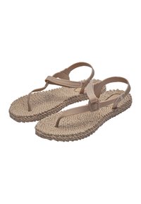 Beige sandals with a braided rope sole, flat design, and nylon straps. Features an adjustable ankle strap for secure fit. Textured surface.