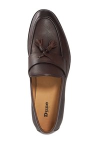 Brown leather loafer with a textured finish, featuring a smooth strap and tassel accents. Interior is tan with branding.