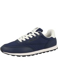 Navy siniset urheilukengät valkoisilla nauhoilla ja yksityiskohdilla, joissa on sileä nahkapinta, teksturoituja paneeleja ja kuvioitu musta kumipohja.