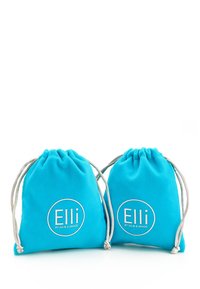 Turquoise drawstring bags made of soft fabric, featuring silver accents and circular logos that read "Elli by Julie & Grace."