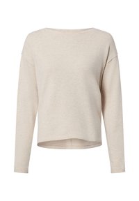 Jasnobeżowa bluzka z długim rękawem o luźnym kroju, z okrągłym dekoltem i miękkim, teksturowanym materiałem. Dół bluzki jest nieco krótszy z przodu niż z tyłu.