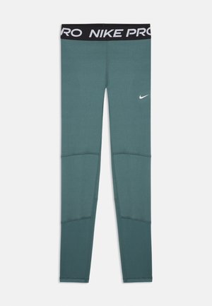 Teal fitted Nike Pro leggings with black waistband featuring white "NIKE PRO" text and a small white Nike swoosh on left thigh.