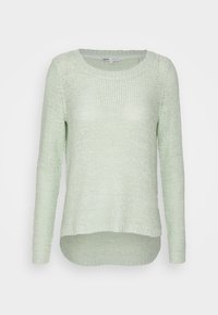 Světle zelený pletený svetr s dlouhým rukávem, kulatým výstřihem a mírně delším zadním lemem.