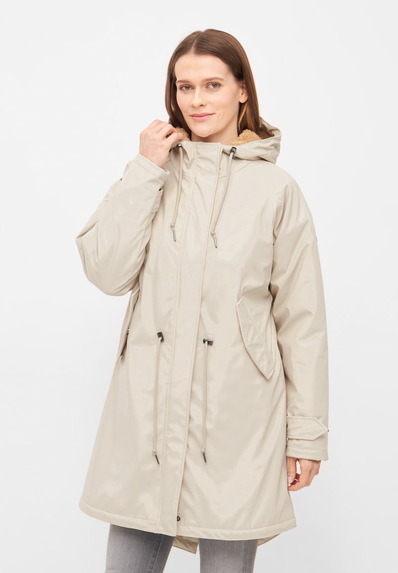 Beige waterproof parka with a hood, drawstring waist, and side pockets. Smooth texture with a slightly shiny finish and contrasting lining.