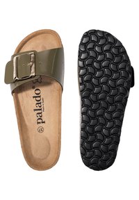 Green patent slide sandal with a large metallic buckle, cork footbed, and black textured rubber sole showcasing a wave pattern.