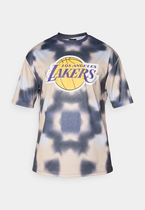 Lakers basketball t-shirt featuring a tie-dye pattern in cream and navy, short sleeves, crew neck, and prominent team logo on front.