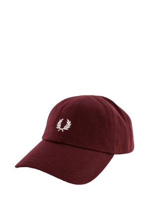 Casquette de baseball marron avec une visière courbée, ornée d'un petit logo de couronne de laurier blanche brodée au centre du panneau avant.