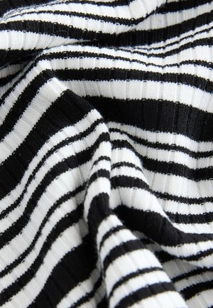 Black and white striped fabric with a ribbed texture; alternating wide and narrow stripes create a bold pattern.