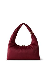 Burgundy soft fabric handbag with a padded, curved handle and gold hardware accents. Features a smooth texture and zip closure on top.