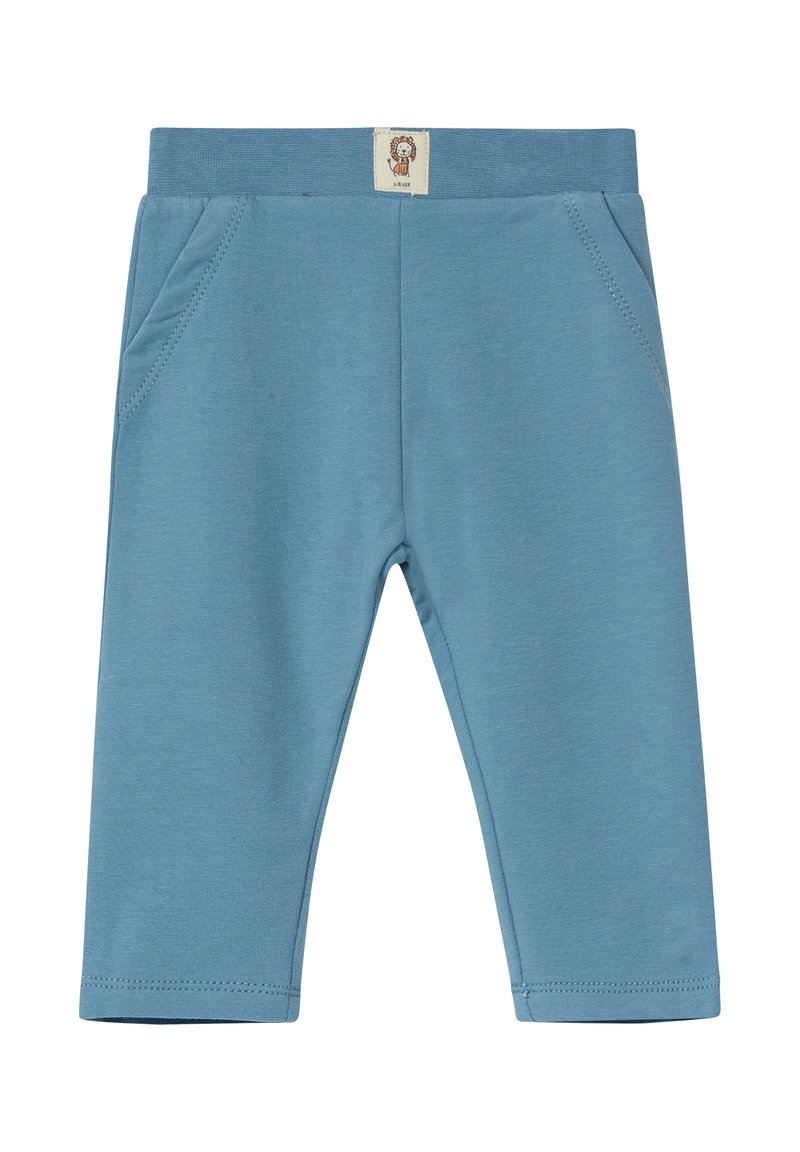 Blauwe katoenen leggings met een zachte textuur, voorzien van een ribbelband, twee zijzakken en een klein label met een leeuwontwerp.