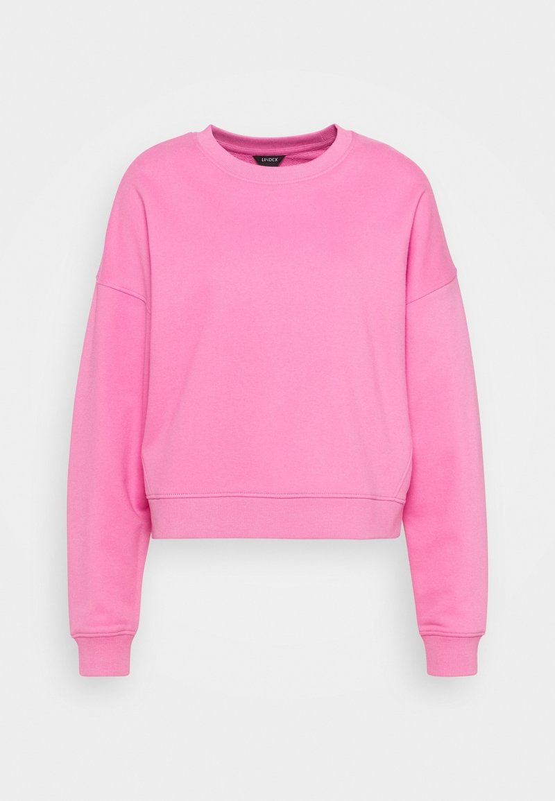 Rosa, kurz geschnittenes Sweatshirt aus weichem Stoff, mit Rundhalsausschnitt, überschnittenen Schultern und gerippten Bündchen. Sanfte Textur und minimale Details.