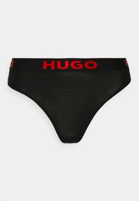 String noir en tissu lisse avec une ceinture élastique rouge contrastante portant le nom de la marque "HUGO" affiché de manière bien visible.