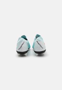Light blue football cleats with black and white accents, featuring a textured surface and a prominent PHANTOM logo at the heel.