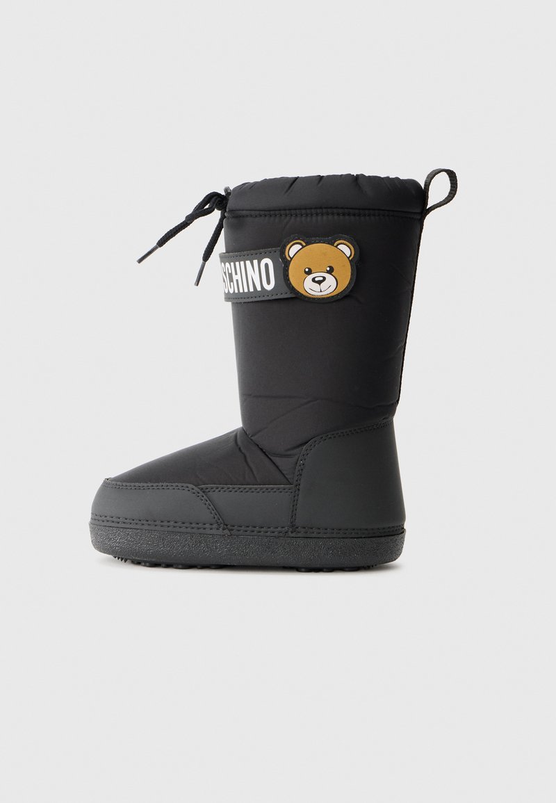 Black padded winter boot with a bear patch and logo. Features a textured rubber sole and adjustable laces at the top for a snug fit.