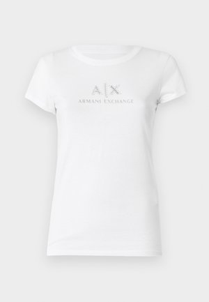 Maglietta bianca in cotone a maniche corte con un logo argentato "A|X ARMANI EXCHANGE" al centro. Collo a giro classico.