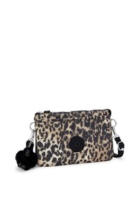 Leopard-print fabric crossbody bag with a black logo patch, silver hardware, and a black pom-pom keychain accent. Two zippered compartments.