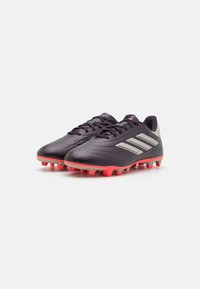 Black and gray soccer cleats with red rubber studs, featuring a smooth synthetic upper and three silver stripes on the side.