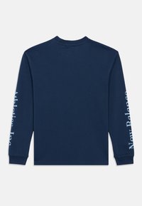 Navy blue long-sleeve shirt with light blue text reading "Athletics Inc" on left sleeve and "New Balance" on right sleeve, shown from the back.