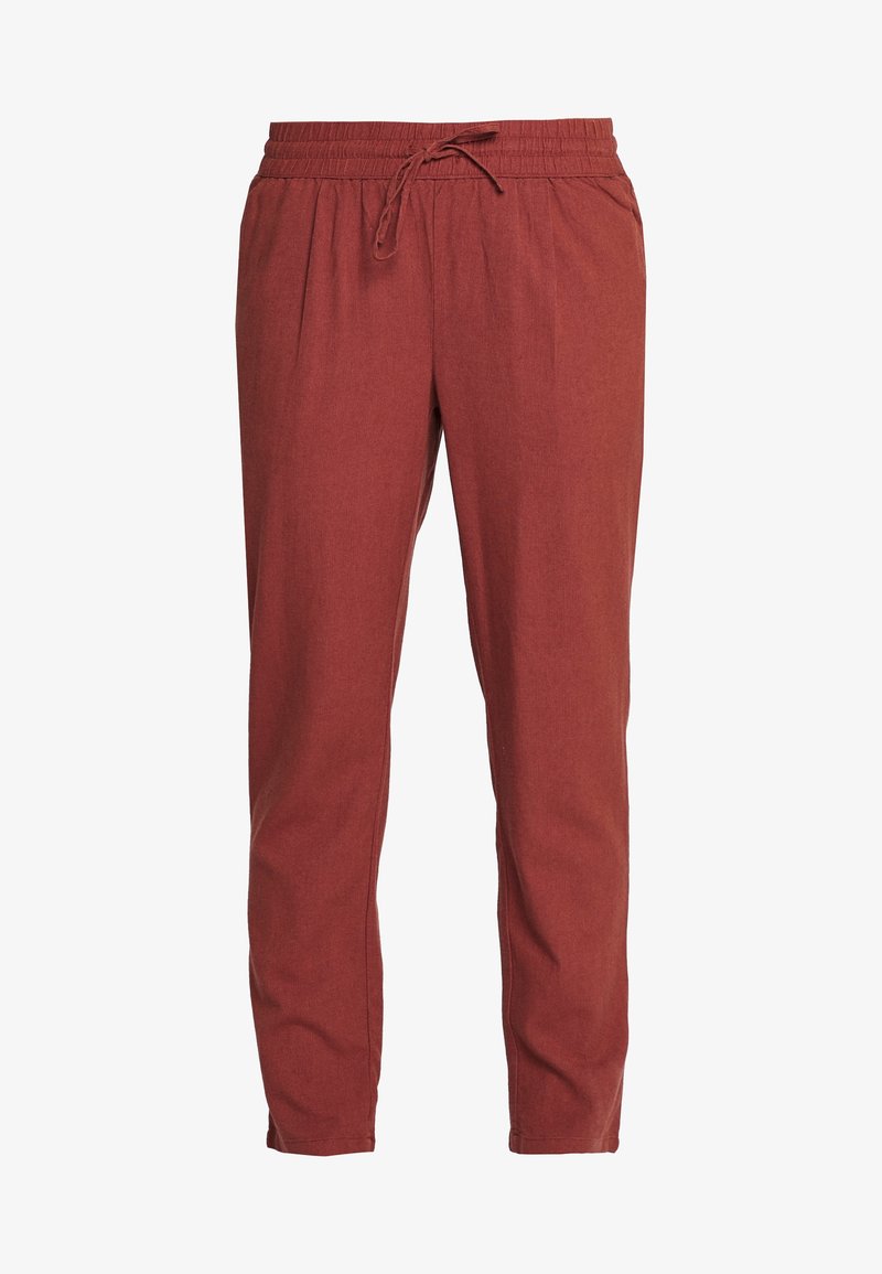 Pull-on pants made of soft, textured fabric in a rusty red color. Features an elastic waistband with drawstring and tapered leg design.