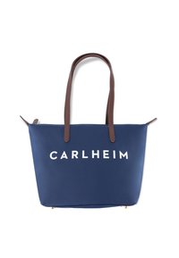 Sac fourre-tout bleu marine avec poignées en cuir marron, doté d'un logo blanc "CARLHEIM" sur le devant. Texture lisse et forme rectangulaire. Fermeture à glissière.