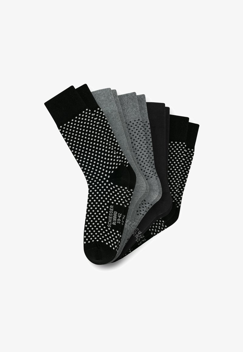 Lot de six chaussettes en noir, gris foncé et gris clair. Les motifs comprennent des accents à pois sur la paire noire. Fabriquées dans un matériau doux et extensible.