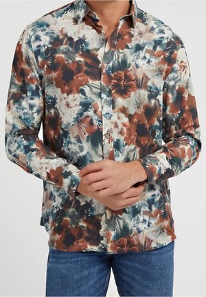 Overhemd met knopen en een bloemenpatroon in aardetinten van bruin, blauw en crème. Gemaakt van lichte stof met een standaard kraag.