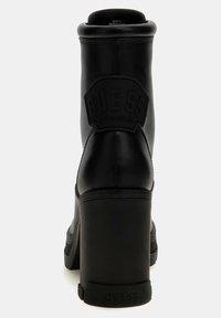 Guess XENNIA - Bottines à plateau - schwarz