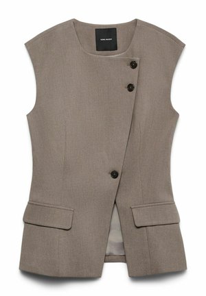 Brūns bezmugurs veste ar strukturētu dizainu, divām priekšējām kabatām un melnām pogām. Iezīmējas ar smalku teksturētu audumu. Iekšpuse ir izklāta.