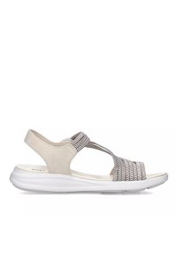 Sandal color beige chiaro con lacci elastici intrecciati, suola bianca imbottita e dettagli testurizzati. Design con tacco aperto per traspirabilità e comfort.