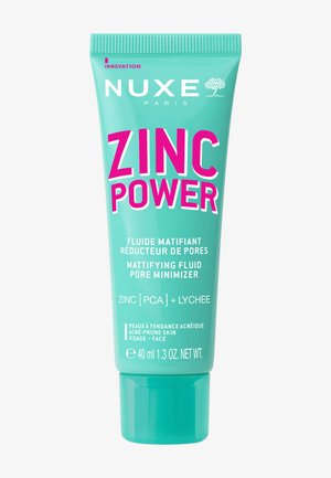 NUXE Zinc Power, 40 ml, in a turquoise tube with a flip-top cap. Features bold pink text for product name, with additional details in white.