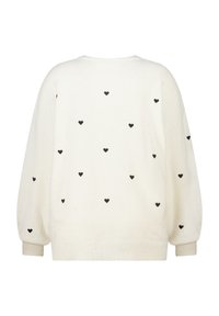 Witte sweater met verspreide zwarte hartpatronen, ronde hals, ballonmouwen en geribde manchetten. Zachte textuur, casual ontwerp.