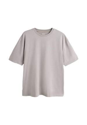 Svetlosivé oversize tričko s krátkym rukávom a okrúhlym výstrihom, položené na plochu na bielom pozadí.